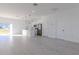 Open concept kitchen and living area with light wood flooring at 1306 Congo Dr, Poinciana, FL 34759