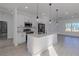 Bright kitchen featuring a large island and stainless steel appliances at 1306 Congo Dr, Poinciana, FL 34759