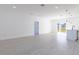 Open living space with light wood floors and access to backyard at 1306 Congo Dr, Poinciana, FL 34759