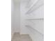 Walk-in pantry with ample shelving for storage at 1306 Congo Dr, Poinciana, FL 34759