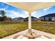 Covered patio with outdoor furniture, overlooking the backyard at 1306 Congo Dr, Poinciana, FL 34759