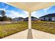 Covered patio overlooking backyard at 1306 Congo Dr, Poinciana, FL 34759