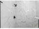 Elegant shower with marble tile at 1306 Congo Dr, Poinciana, FL 34759