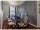 Modern dining room with dark wood table and gray accent wall at 3044 Cameron Dr, Kissimmee, FL 34743