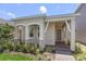 Exterior of charming one-story home with landscaped yard at 15424 Enchanted Melody Way, Winter Garden, FL 34787