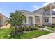 One story home with covered entry and stone accents at 15424 Enchanted Melody Way, Winter Garden, FL 34787