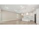 Spacious living room with light wood floors and access to backyard at 15424 Enchanted Melody Way, Winter Garden, FL 34787