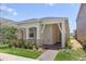 One-story home with a covered porch and landscaped yard at 15424 Enchanted Melody Way, Winter Garden, FL 34787