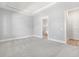Main bedroom with carpet and access to the bathroom at 15424 Enchanted Melody Way, Winter Garden, FL 34787