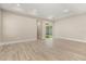Bright and airy living room with sliding door to patio at 15424 Enchanted Melody Way, Winter Garden, FL 34787