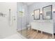 Bathroom boasts a walk-in shower, double vanity, and modern fixtures at 15424 Enchanted Melody Way, Winter Garden, FL 34787