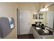 Clean bathroom with granite countertop and modern fixtures at 7671 Comrow St # 302, Kissimmee, FL 34747