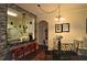 Dining area with a round glass table and four black chairs at 7671 Comrow St # 302, Kissimmee, FL 34747