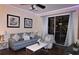 Bright living room featuring comfy seating and access to a balcony at 7671 Comrow St # 302, Kissimmee, FL 34747