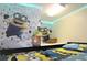 Bright bedroom with bunk beds, Minion-themed decor, and LED lighting at 7671 Comrow St # 302, Kissimmee, FL 34747