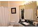 Clean bathroom with granite countertop, shower, and updated fixtures at 7671 Comrow St # 302, Kissimmee, FL 34747
