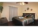 King bedroom with dark wood furniture and elegant decor at 7671 Comrow St # 302, Kissimmee, FL 34747