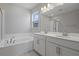 Main bathroom with double vanity, soaking tub and separate shower at 2035 Stetson Ct, Eagle Lake, FL 33839