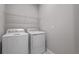Laundry room with washer, dryer and overhead shelving at 2035 Stetson Ct, Eagle Lake, FL 33839