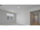 Bright and airy living room with tile floors and access to the hallway at 2035 Stetson Ct, Eagle Lake, FL 33839
