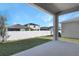 Covered patio with view of backyard and neighboring homes at 2035 Stetson Ct, Eagle Lake, FL 33839