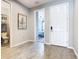 Bright entryway with tile floors and a view into a bedroom at 592 Lake Smart Blvd, Winter Haven, FL 33881