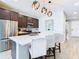 Modern kitchen with stainless steel appliances and breakfast bar at 592 Lake Smart Blvd, Winter Haven, FL 33881
