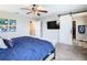 Spacious main bedroom with a large TV and walk-in closet at 592 Lake Smart Blvd, Winter Haven, FL 33881