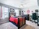 Baseball-themed bedroom with a twin bed, dresser, and desk at 592 Lake Smart Blvd, Winter Haven, FL 33881