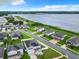 Aerial view of lakefront neighborhood with solar panels at 592 Lake Smart Blvd, Winter Haven, FL 33881