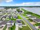 Aerial view of lakefront neighborhood with solar panels at 592 Lake Smart Blvd, Winter Haven, FL 33881