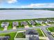 Aerial view of houses with solar panels, showcasing a lakefront community at 592 Lake Smart Blvd, Winter Haven, FL 33881