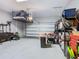 Organized garage with overhead storage and shelving at 592 Lake Smart Blvd, Winter Haven, FL 33881