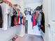 Spacious walk-in closet with ample hanging space and shelving at 592 Lake Smart Blvd, Winter Haven, FL 33881