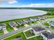 Aerial view of lakefront homes with solar panels at 592 Lake Smart Blvd, Winter Haven, FL 33881