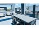 Relaxing rooftop deck with outdoor dining furniture and lounge chairs at 7740 Sandy Ridge Dr # 226, Kissimmee, FL 34747
