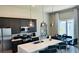 Modern kitchen with dark cabinetry and island at 7740 Sandy Ridge Dr # 226, Kissimmee, FL 34747