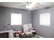 Versatile bedroom with two chairs and a work desk at 225 E Pomelo St, Lake Alfred, FL 33850