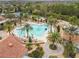Resort-style pool with palm trees and surrounding lounge areas at 742 San Joaquin Rd, Poinciana, FL 34759