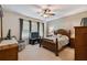Spacious bedroom with a wooden bed frame and large windows at 742 San Joaquin Rd, Poinciana, FL 34759