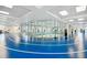 Indoor running track with glass walls overlooking community areas at 742 San Joaquin Rd, Poinciana, FL 34759