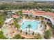 Resort-style pool with surrounding lounge chairs and landscaping at 742 San Joaquin Rd, Poinciana, FL 34759
