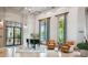 Elegant lobby with comfortable seating, grand piano, and large windows at 742 San Joaquin Rd, Poinciana, FL 34759