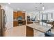 Open concept kitchen with stainless steel appliances and an island at 742 San Joaquin Rd, Poinciana, FL 34759