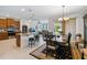 Open kitchen with island, dining area, and Gathering room access at 742 San Joaquin Rd, Poinciana, FL 34759