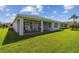 Spacious backyard with covered patio and lawn at 742 San Joaquin Rd, Poinciana, FL 34759