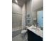 Clean bathroom with tub, shower, and modern vanity at 7760 Sandy Ridge Dr # 214, Kissimmee, FL 34747