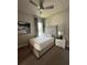Spacious bedroom with a large bed, window, and ceiling fan at 7760 Sandy Ridge Dr # 214, Kissimmee, FL 34747