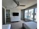 Bright bedroom with two twin beds, dresser, and game room view at 7760 Sandy Ridge Dr # 214, Kissimmee, FL 34747