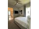 Bedroom with a queen bed, en-suite bathroom, and TV at 7760 Sandy Ridge Dr # 214, Kissimmee, FL 34747